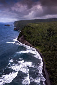 Big waves crash against the rocks of the big island, hawaii. 