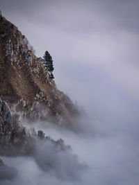 Low angle view of rock formations against sky