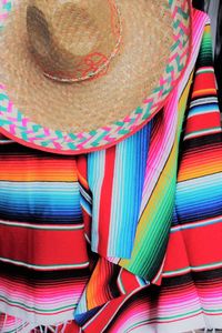 Close-up of hat on multi colored pencils