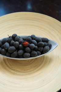 High angle view of blueberries in bowl on table