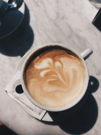 High angle view of cappuccino on table