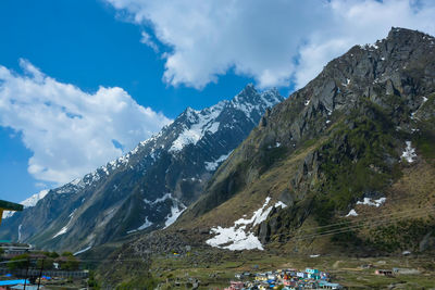 Scenic view of snowcapped mountains against sky