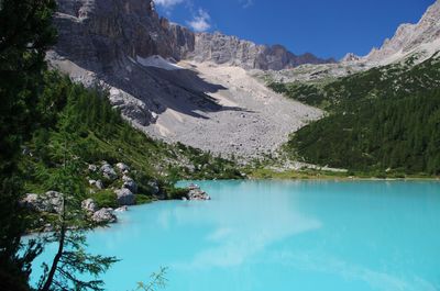 Scenic view of mountains against blue sky