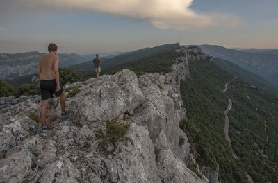 Rear view of man walking on mountain