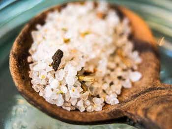 Close-up of salt with spice on wooden spoon
