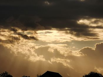 Low angle view of dramatic sky during sunset