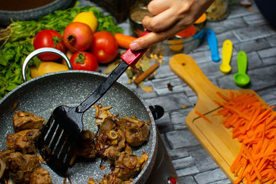 Midsection of man preparing food