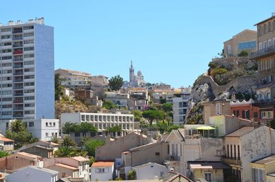 Cityscape against clear sky