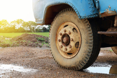 Close-up of abandoned truck on field