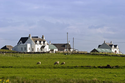 View of building on field against sky