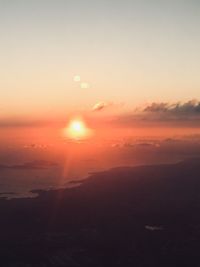 Scenic view of sea against romantic sky at sunset