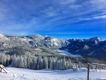 Scenic view of snowcapped mountains against sky