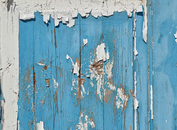 Full frame shot of weathered wooden door