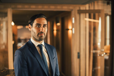 Portrait of confident financial advisor in formals at legal office