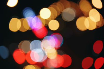 Defocused image of illuminated lights at night
