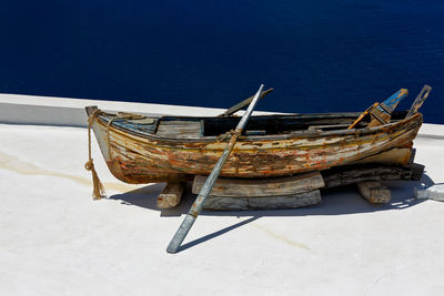 High angle view of fishing boat moored on beach