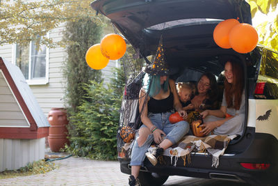 Portrait of people sitting in car