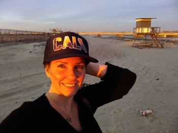 Portrait of smiling young woman on beach