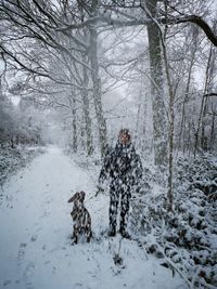 View of dog on snow covered landscape