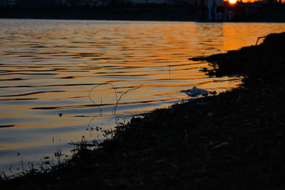Scenic view of lake during sunset
