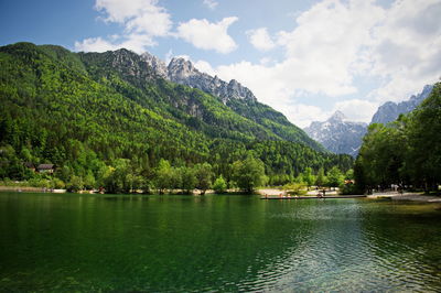 Scenic view of jasna lake with slovenian alps in background