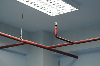 Low angle view of pipe on wall