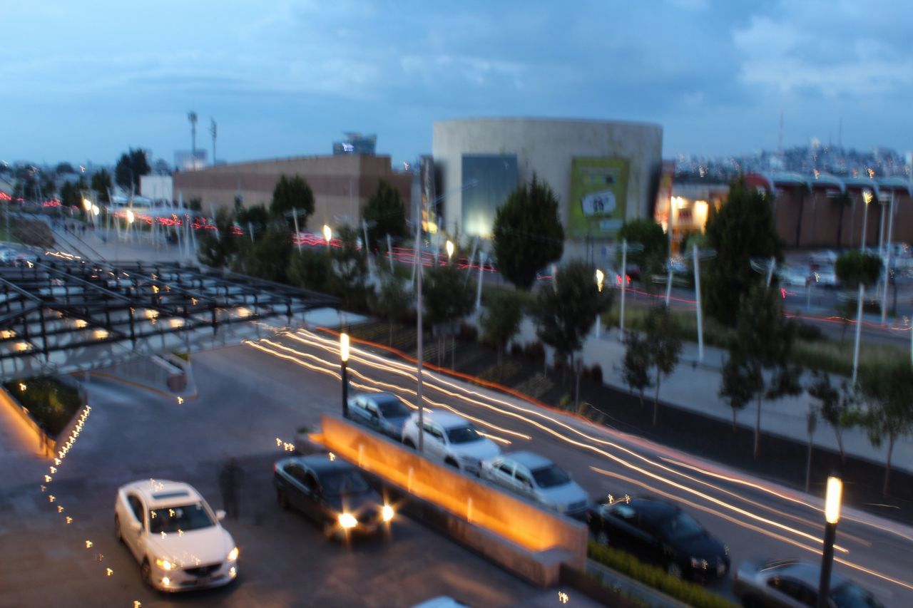 HIGH ANGLE VIEW OF ROAD PASSING THROUGH CITY