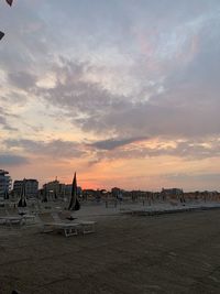 Scenic view of beach against sky during sunset