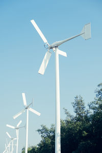 Low angle view of windmill against sky