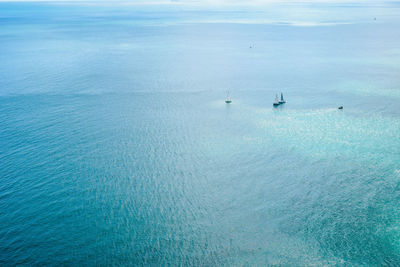 High angle view of sailboat sailing in sea