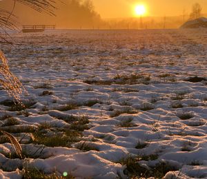 Scenic view of frozen lake against sky during winter