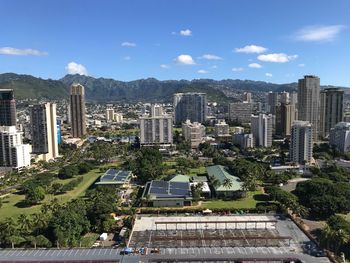 High angle view of buildings in city against sky