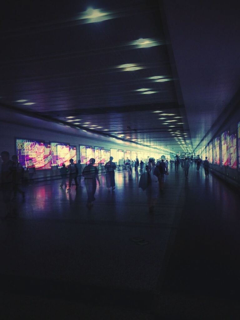 PEOPLE WALKING IN SUBWAY STATION