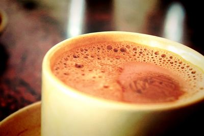 Close-up of cappuccino on table