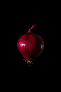 Close-up of strawberry over black background