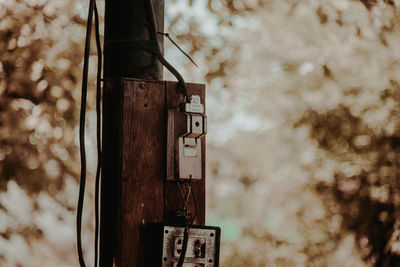 Close-up of old rusty metallic structure against sky