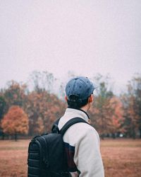 Rear view of man on snow covered land