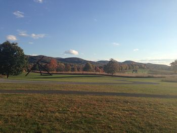 Scenic view of farm against sky