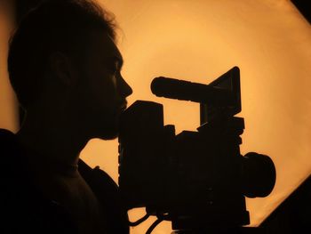 Low angle view of silhouette person against sky