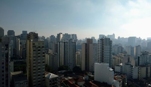 Modern buildings in city against sky