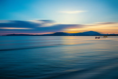 Scenic view of sea against sky at sunset