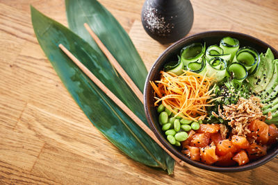 High angle view of chopped vegetables in bowl on table