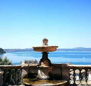 View of sea against clear blue sky