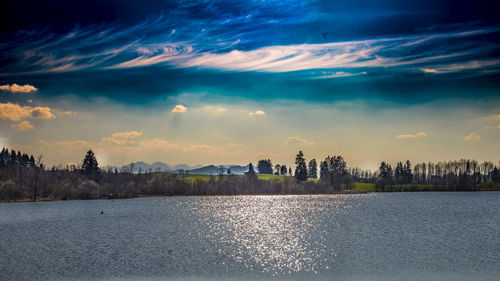 Scenic view of sea against sky in city