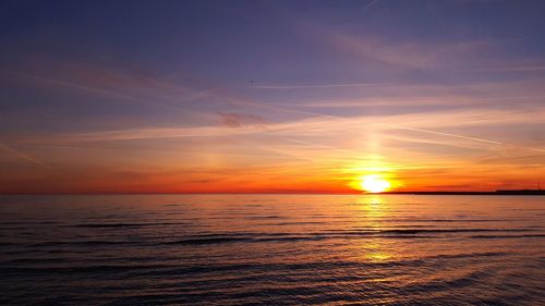 Scenic view of sea at sunset