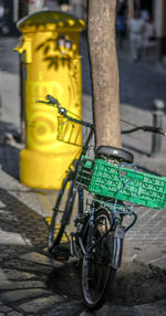 Close-up of yellow bicycle