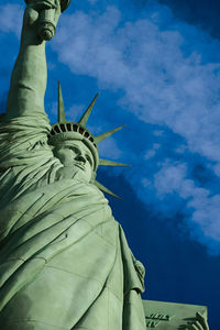 Low angle view of statue against blue sky