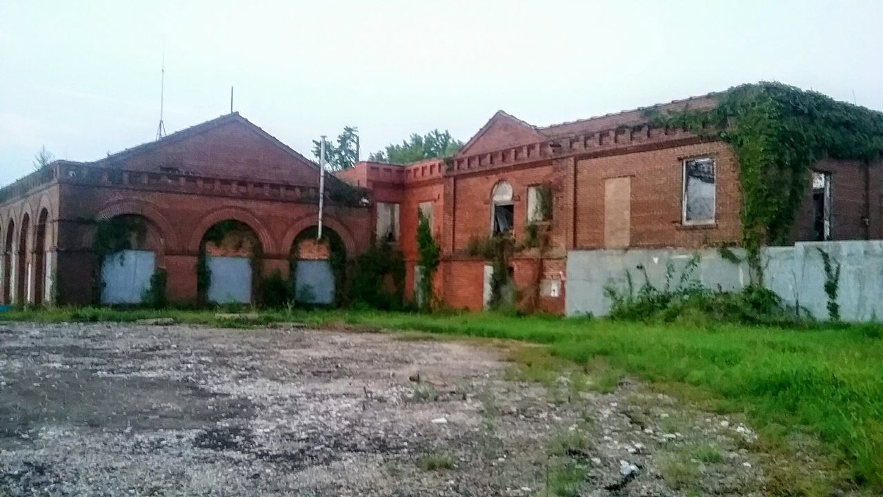 OLD BUILDING AGAINST CLEAR SKY