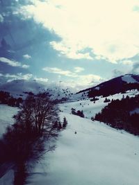 Scenic view of snowcapped mountain against sky