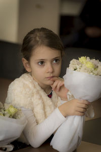 Portrait of girl holding flower